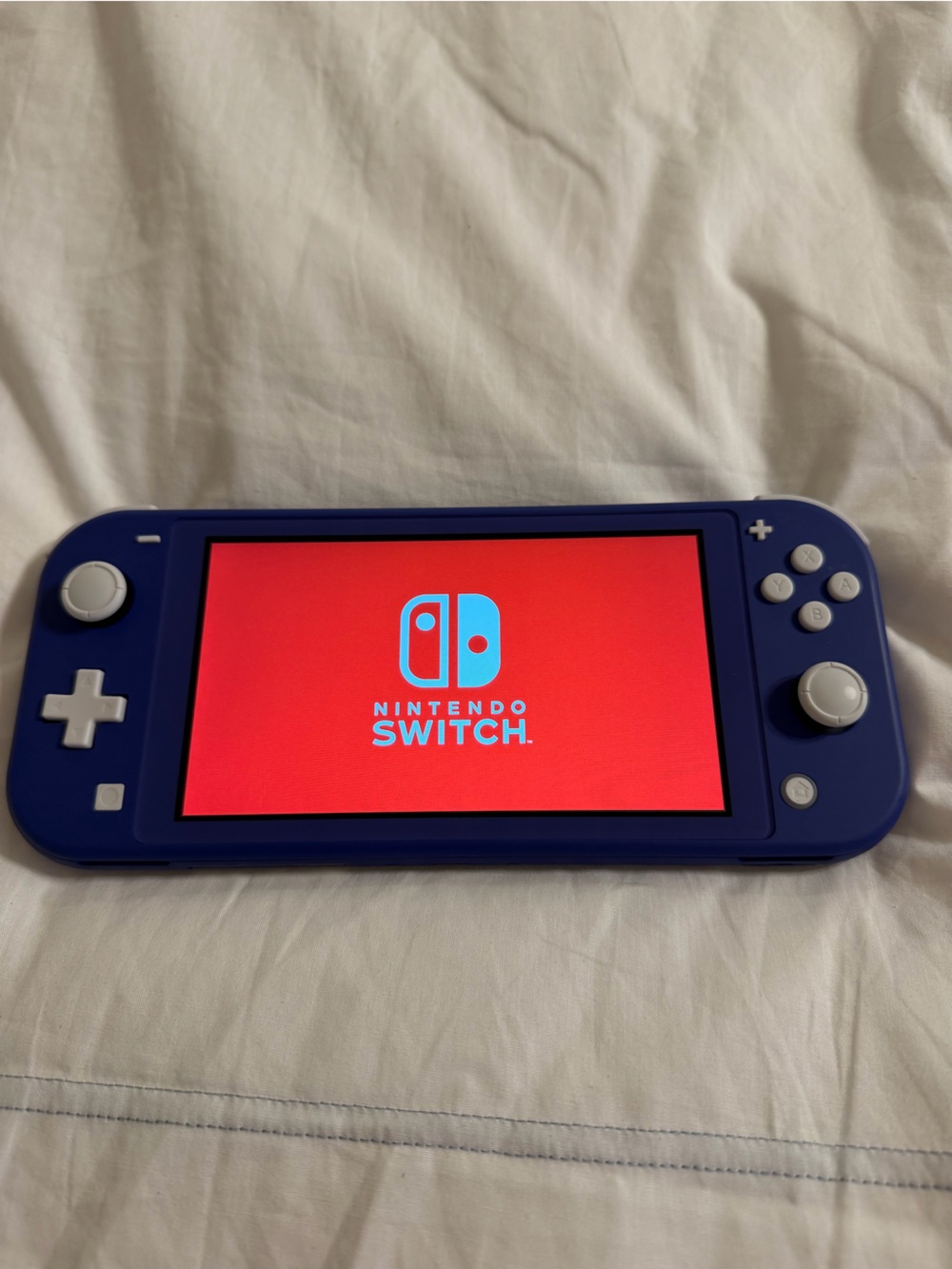 Nintendo Switch Lite Blue Handheld Console with White Buttons